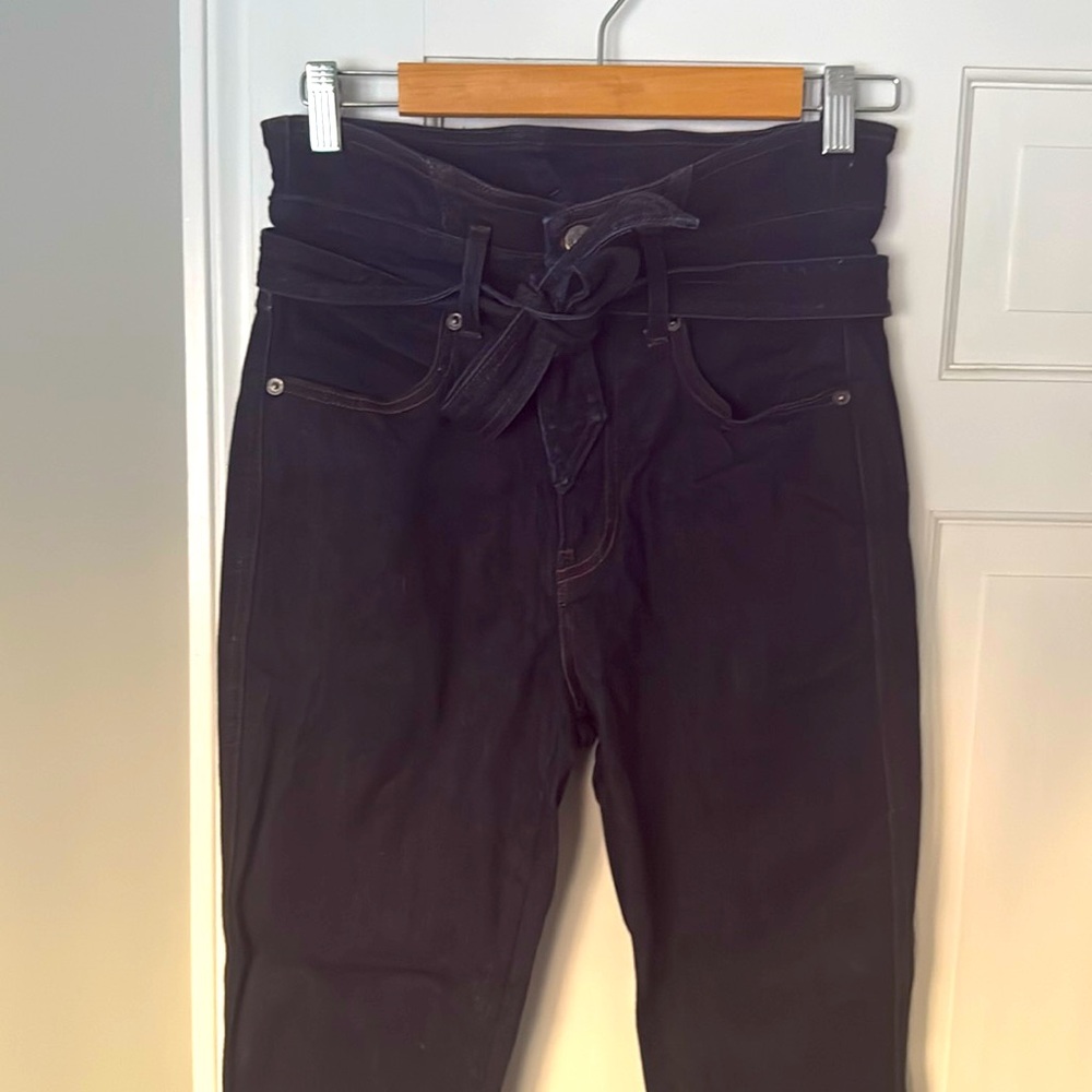 High rise, flare, belted, dark blue denim.